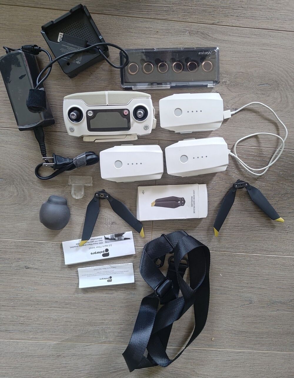 The DJI box is misc. drone remote, 3 batteries & charger and Misc parts w case